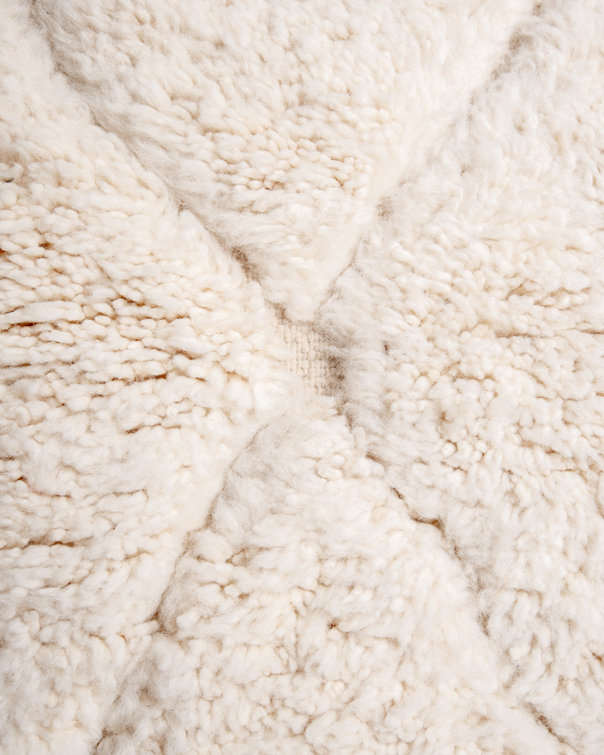 Modern, designer, handcrafted Berber rug from Morocco. Beniourain carpet with minimalist design, natural wool pile and a fluffy texture